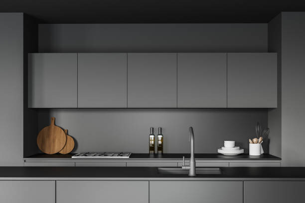 istock Dark gray kitchen interior with island, close up 1295653816