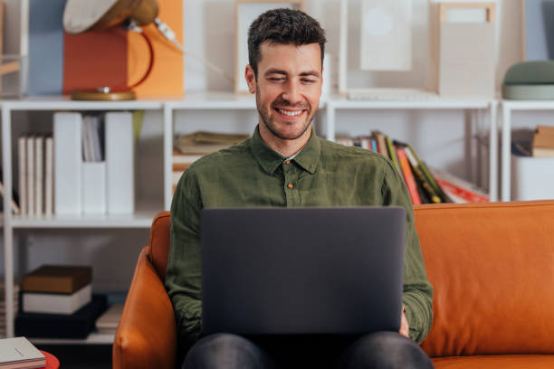 istock Happy Handsome Caucasian Businessman Working on his Laptop Computer in the Office 1295653973