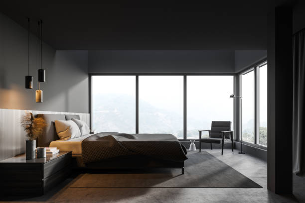 istock Gray master bedroom interior with bed and armchair 1295654412