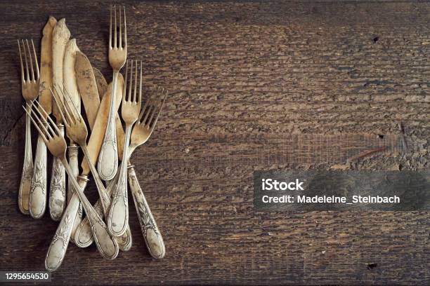 Old Rusted Vintage Silverware On A Wooden Background Top View Stock Photo - Download Image Now