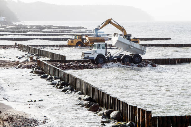 istock excavator loads soil into a large truck 1295654726
