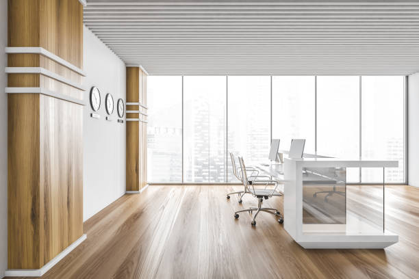 istock White and wooden office interior with reception, side view 1295655735