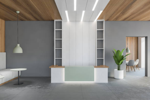 istock White reception desk in open space hall, wooden ceiling and grey floor 1295655873