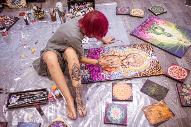 istock Pink colored hair young woman being busy with creative work 1295658014