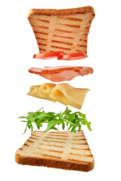 istock Fresh sandwich with flying ingredients on white background isolated. Fly food concept 1295659232