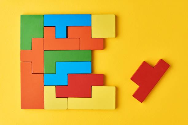 istock Logical thinking concept. Different shapes colorful wooden blocks on white background 1295659476