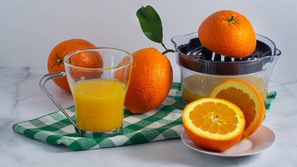 istock Freshly squeezed orange juice in a minimalist still life 1295660150