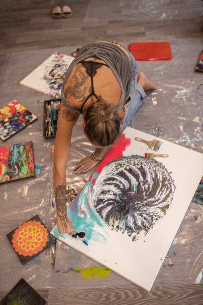 istock Blond hair young woman being busy with creative work 1295660654