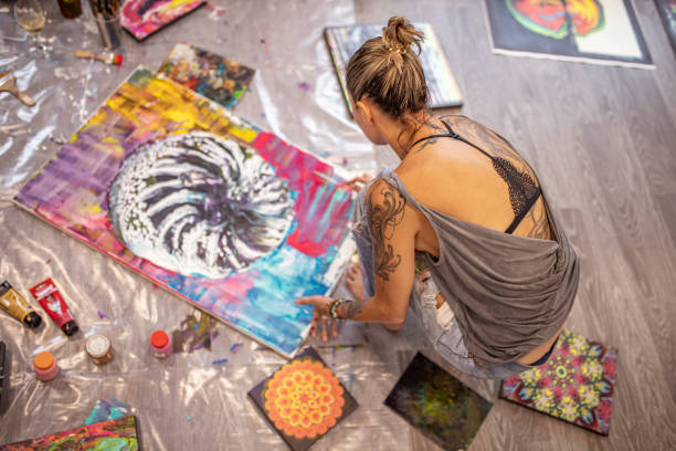 istock Blond hair young woman being busy with creative work 1295660852
