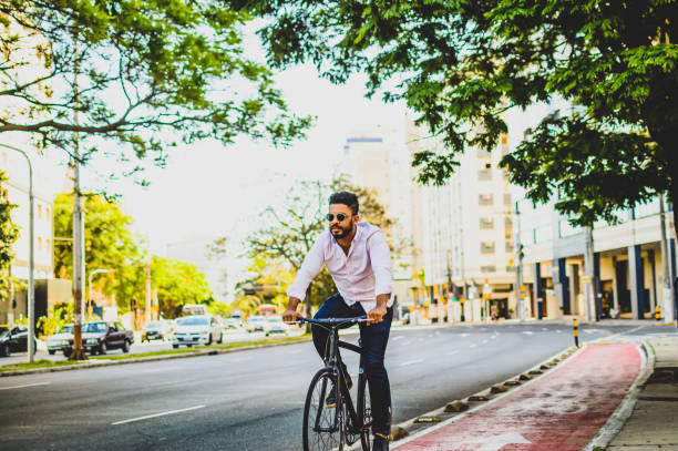 istock a man on a bicycle on a bike path in porto alegre 1295662133