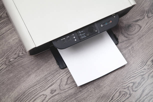 istock Xerox printer machine and papers on the desk. 1295662885