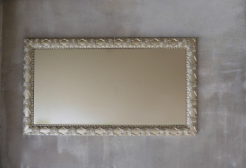 Frames, picture frames, mirror frames. \nDecorative style, rectangular, bronze colored, isolated.