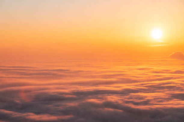 istock Beautiful sunset sky above clouds, dramatic sunset sky. Nature background, aerial view. 1295665939
