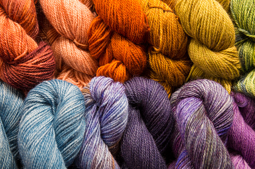 Colorful, hand dyed wool yarn for sale at a local farmers market in Seattle, WA