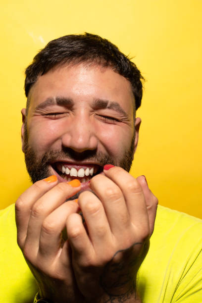 istock Portrait of a young man laughing 1295667562
