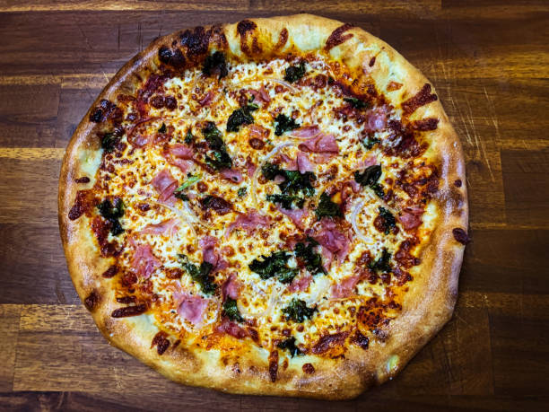 istock Ham, Onion and Kale Pizza 1295668436
