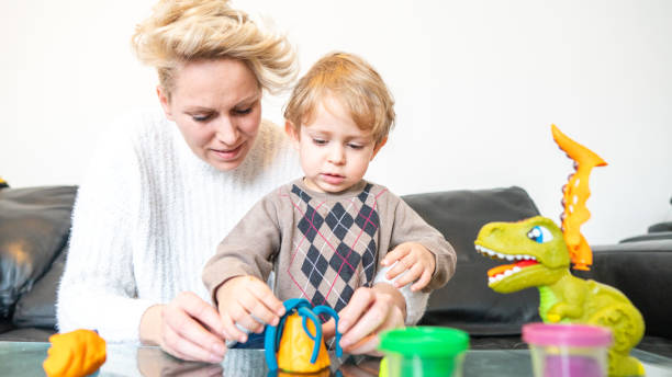 istock Cute mother and kid boy playing together 1295668779