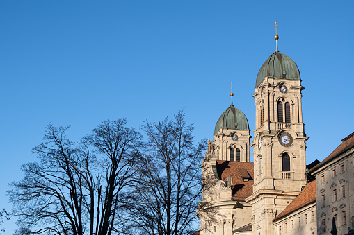 Einsiedeln, Switzerland - November 25, 2020: The Benedictine Abbey of Einsiedeln with its mighty basilica is the main catholic pilgrimage center in Switzerland