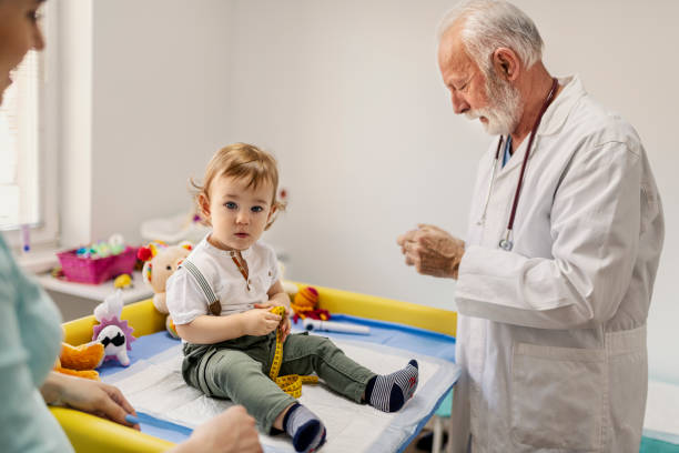 istock Doctor in pediatrics with a baby boy 1295668915