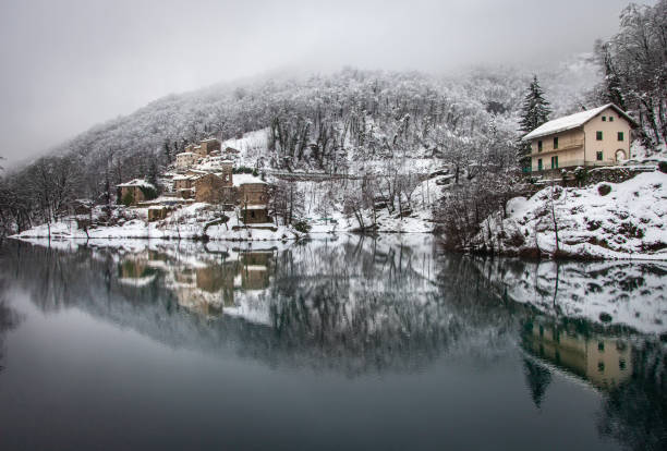 Apuan Alps, Tuscany : Isola Santa village which rises on the lake of the same name, in winter.The lake is of artificial origin, when the dam was built many house were submerged .