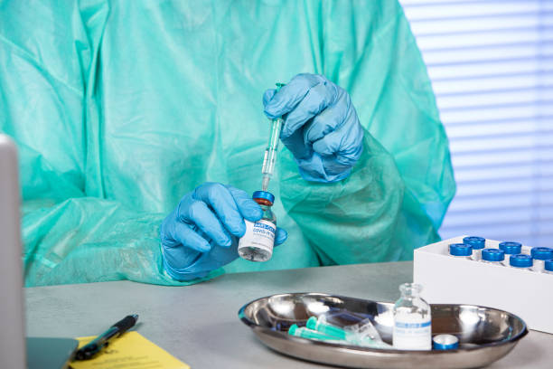 istock Doctor preparing COVID-19 coronavirus vaccine 1295669750