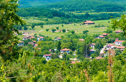 White houses in a picturesque Bulgarian village Makotsevo are nestled among the beautiful nature