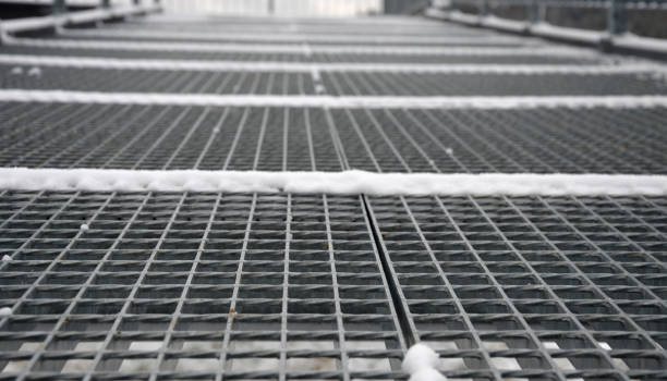istock gray snow-covered staircase observation deck construction with high resistance to deformation even under heavy load Galvanized steel welded floor grate, railings, orientation boards with landscape map 1295671586
