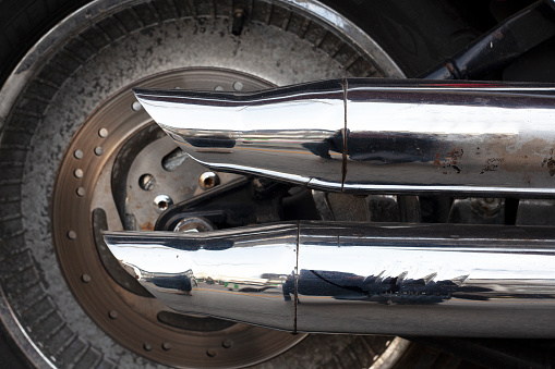 Close-up of aluminium rim of luxury car wheel. Detail background