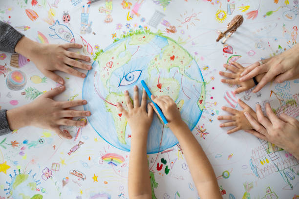 istock Top view on child's hands drawing. 1295675374