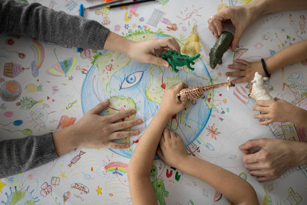 istock Top view on child's hands playing with toys 1295675511