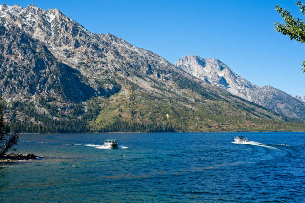 istock Passing boats on Jenny Lake 1295675554