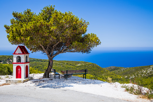 Zakynthos, Greece. Lookout point with bench and tree.