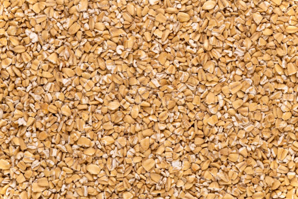 스틸 컷 귀리, 아일랜드 귀리 배경 - steel cut oats 뉴스 사진 이미지