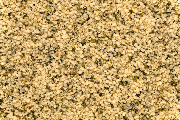 оболочка семена конопли фон - hemp seed nut raw стоковые фото и изображения