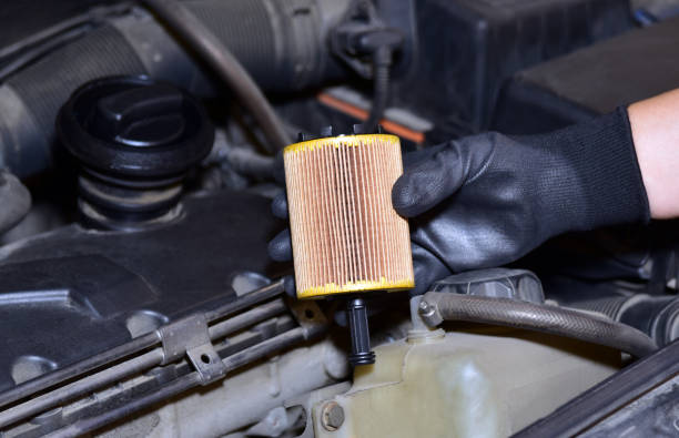 Replacement of car oil filter stock photo