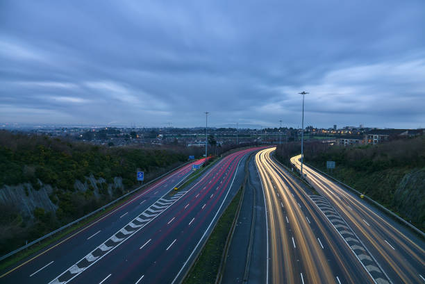 Beautiful very long exposure evening view of light trails of vehicles on motorway M50 Dublin, Ireland stock photo