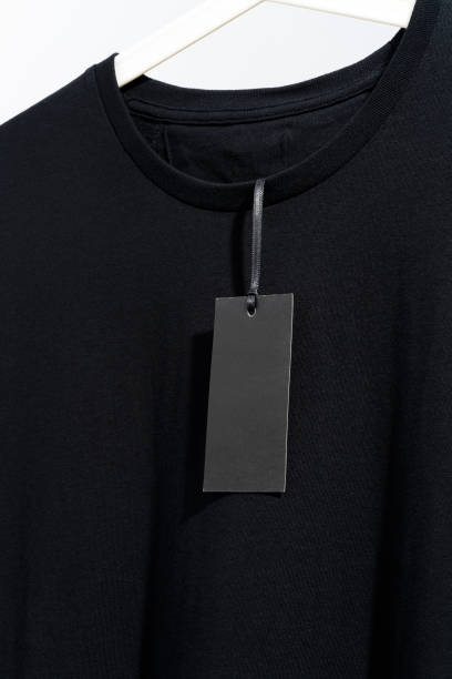 White t-shirt with blank black price tag, displayed on white hanger