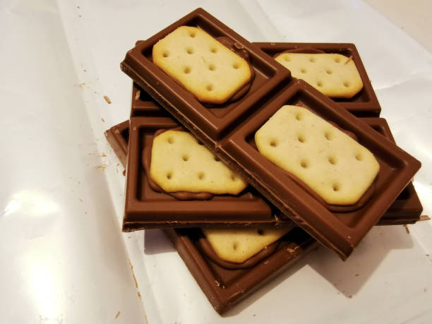 istock Pieces of brown chocolate with salty crackers 1295691749