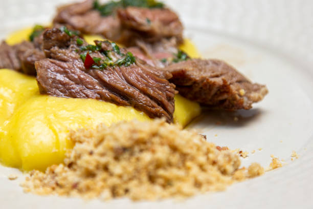 istock Ancho steak with mashed and crispy manioc flour. 1295692606
