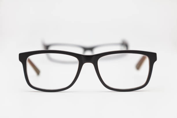 istock Two pairs of eyeglasses on a white background 1295692906