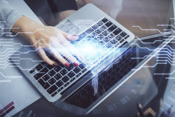 istock Multi exposure of woman hands working on computer and human brain hologram drawing. Ai tech concept. 1295693691