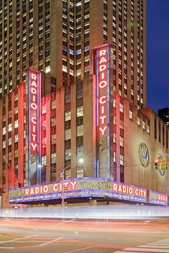 New York City, USA - January 28, 2020: Night time view of the Radio City Music Hall located in Rockefeller Center. Nicknamed “the Showplace of the Nation”, It is one of the largest theaters in the country and a major tourist destination in the New York City.