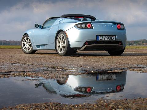 Warsaw, Poland – 18th November, 2009: Zero emission Tesla Roadster (2008-2012) stopped on a road. The Roadster model is the first vehicle from Tesla brand. This model was also the first car in space.