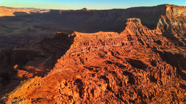 istock Sunset over a red rock canyon 1295698535