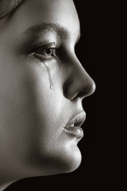 istock sad crying woman 1295698615