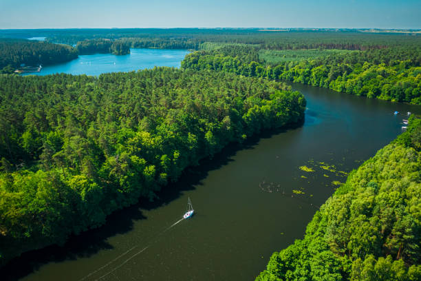 istock White boat on a big river in summer, Poland 1295700933