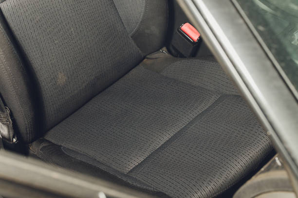 istock Car interior textile seats chemical cleaning with professionally extraction method. Early spring cleaning or regular clean up. 1295701647
