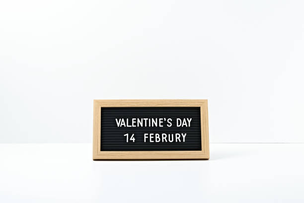 istock The inscription Valentine's Day in a frame on a white background. Copy space, mock up. 1295701888