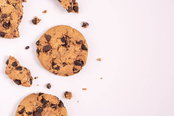 istock dark chocolate chip cookies piece stack and crumbs 1295701969