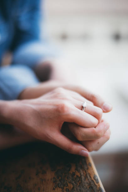 istock Close-Up Of Couple Holding Hands 1295707462